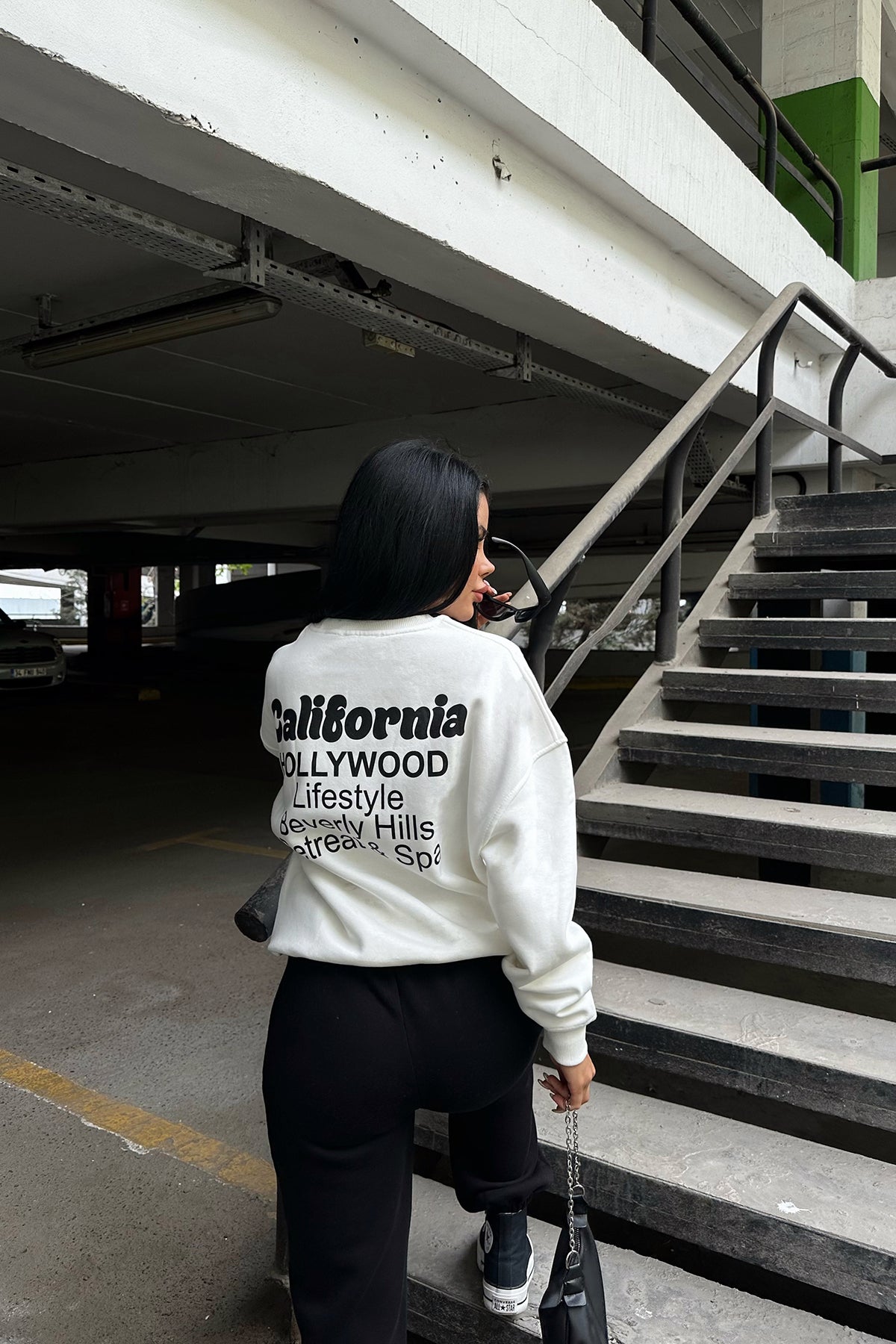 White Sweat with Writing on the Back