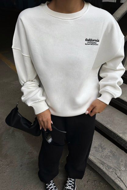 White Sweat with Writing on the Back