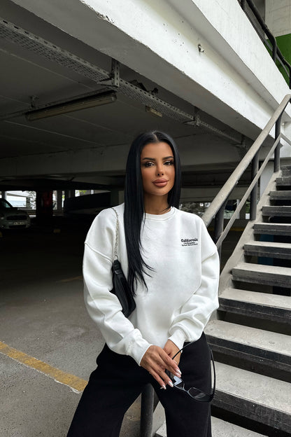 White Sweat with Writing on the Back